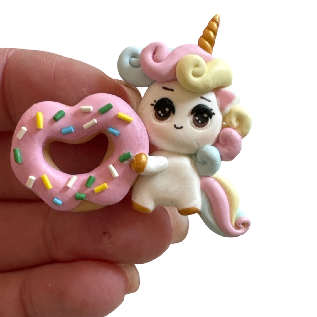 Unicorn holding Heart Cookie Bow Clays from Temptress Maker