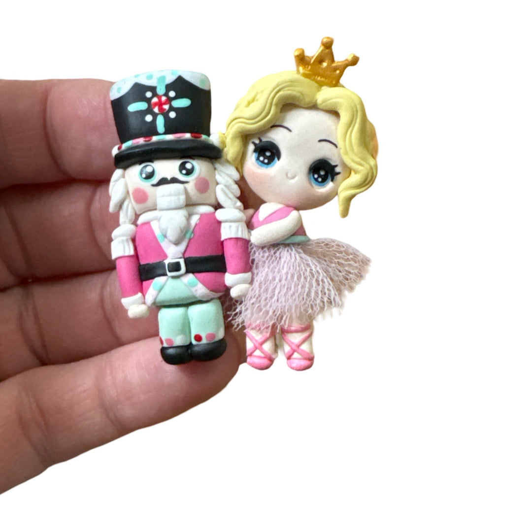Blonde Ballerina holding Nutcracker Bow Clay