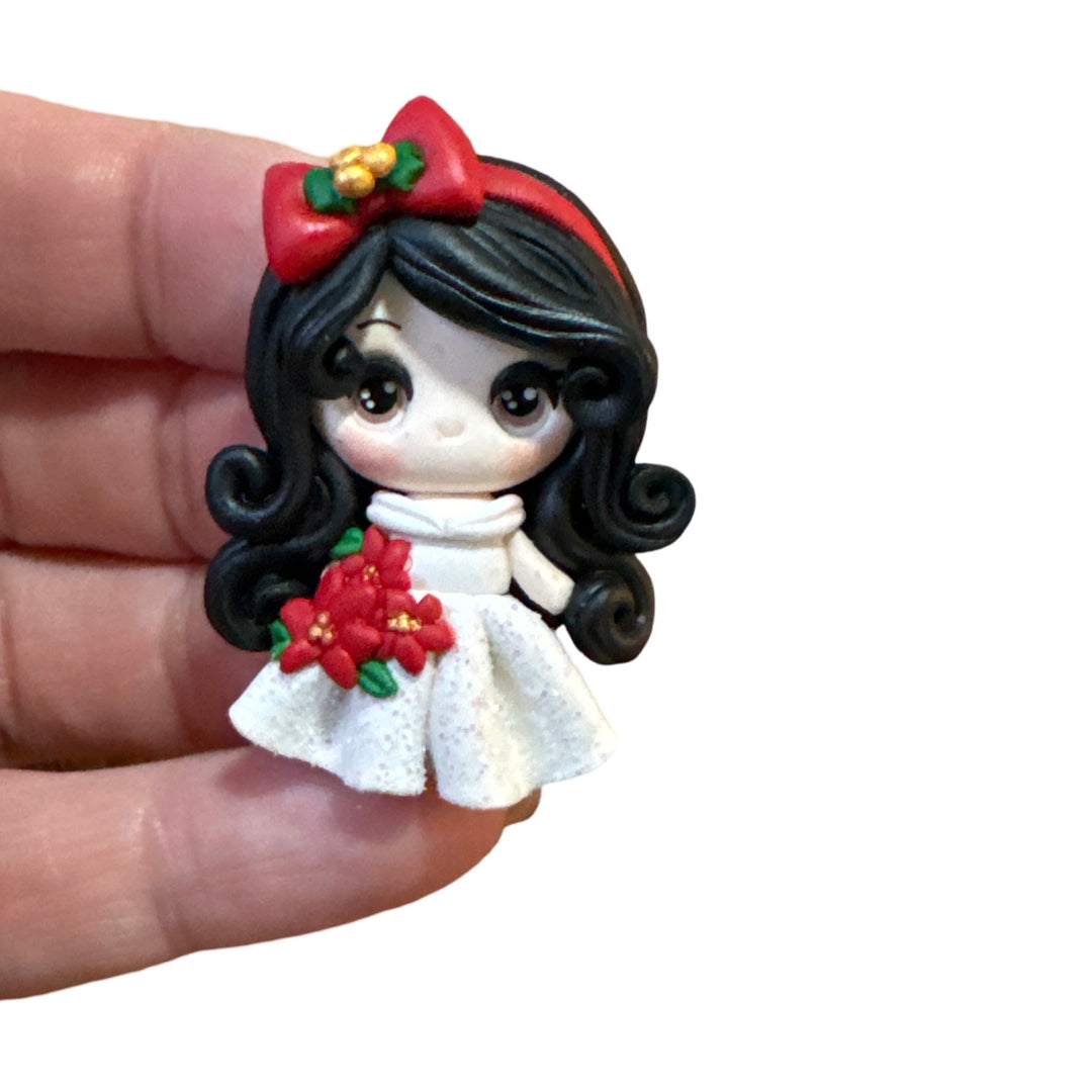 Christmas Girl holding Poinsetta Bow Clay - Black Hair