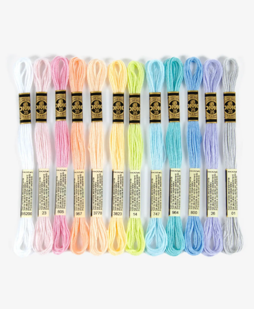 Set of 10 skeins of embroidery thread in pastel colors with DMC labels.